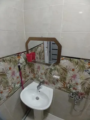 a bathroom with a sink and a mirror at Hakuna Matata in Aswan