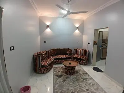 a living room with a couch and a table at Hakuna Matata in Aswan