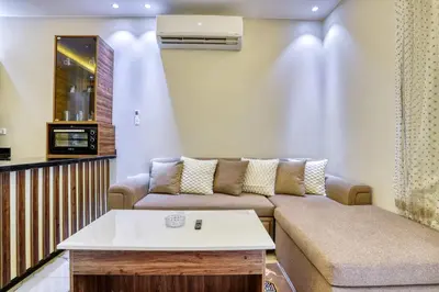 a living room with a couch and a table at La Prestigia luxury Apartments by Peaks in Hurghada