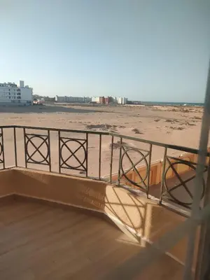 a balcony with a view of the beach at red ruby Comfort in Hurghada