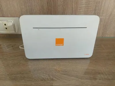 a white laptop computer sitting on top of a table at pola studio at scandic resort in Hurghada