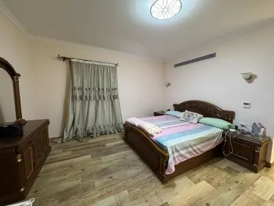 a bedroom with a bed and a dresser and a window at Villa 348 Jamaran - Sahl Hasheesh in Hurghada
