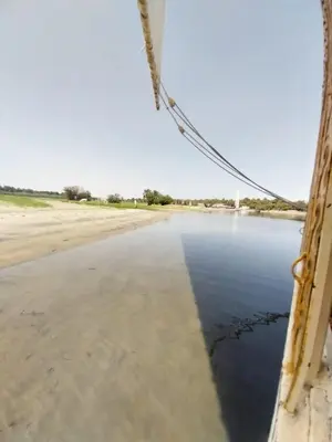 a view from a bridge over the water at valleyofthenileadventures in Luxor