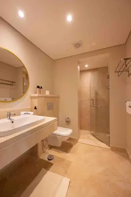 a bathroom with a sink and a toilet and a shower at Mangroovy Stays El Gouna - BirdNest in Hurghada