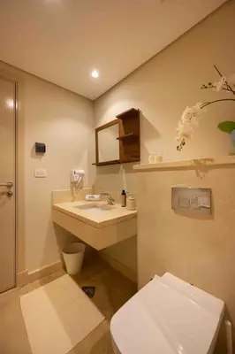 a bathroom with a white toilet and a sink at Mangroovy Stays El Gouna - BirdNest in Hurghada