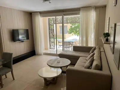 a living room with a couch and a table at mangrovey M9-2B--01 in Hurghada