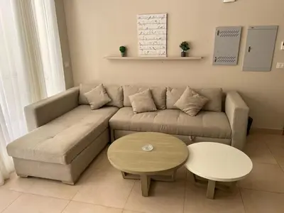 a living room with a couch and a table at mangrovey M9-2B--01 in Hurghada