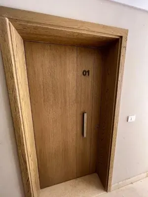 a wooden door with the letter o on it in a room at mangrovey M9-2B--01 in Hurghada