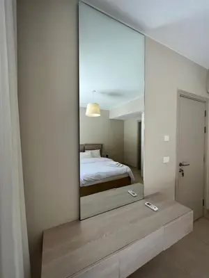 a mirror reflecting a bedroom with a bed in a room at mangrovey M9-2B--01 in Hurghada