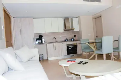a living room with a white couch and a table at mangrovey M9-2B--01 in Hurghada