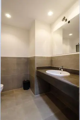 a bathroom with a sink and a mirror at Al Saraya Sahl Hasheesh by Peaks Studio with Pool View C106 in Hurghada