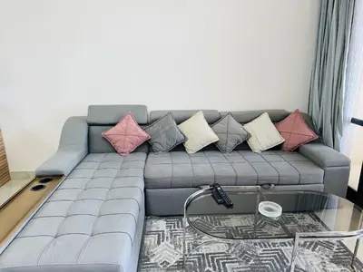 a living room with a couch with pillows on it at Beautiful Island View in Hurghada