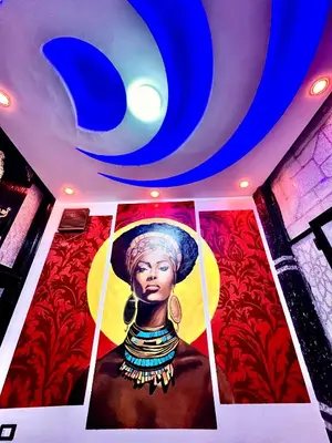 a painting of a woman on the ceiling of a room at Al FAHAD private apartments for rent in Luxor