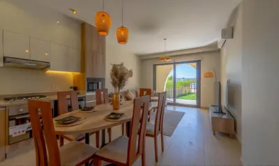 a kitchen and dining room with a table and chairs at Luxury Stays in Shedwan El Gouna in Hurghada