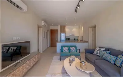 a living room with a couch and a table at Luxury Stays in Shedwan El Gouna in Hurghada