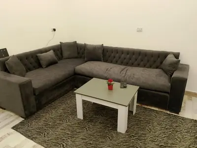 a living room with a couch and a coffee table at White House in Hurghada