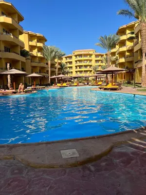 a large swimming pool in front of a hotel at ATO luxurious apartments in Hurghada