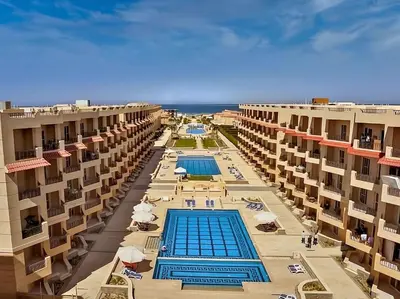 an aerial view of a resort with two swimming pools at Luxury Selena Bay Apartment- Private Beach, Kite School 5 Pools in Hurghada