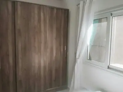 a wooden door in a room with a window at Amazing 2 bedroom apartment with sea view in Hurghada in Hurghada