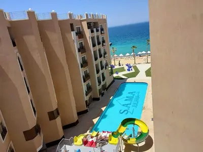 an overhead view of a swimming pool and the beach at Stylish studio with sea view in Hurghada