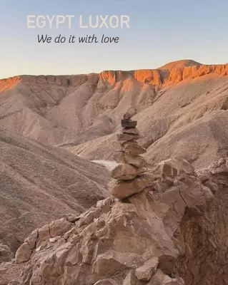 a pile of rocks sitting on top of a mountain at Life in Luxor in Nag` Naqsha