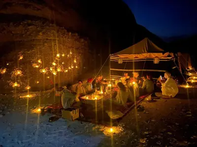 a group of people sitting under a tent with lights at Life in Luxor in Nag` Naqsha