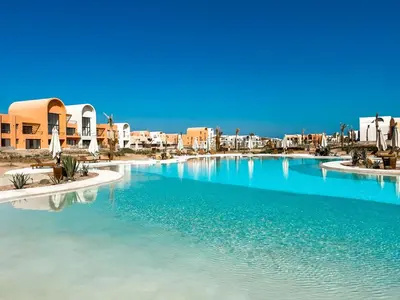 a large pool of water with buildings in the background at Kamaran 2BR • Luxurious Retreat in Hurghada