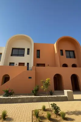 a house in the desert with a building at Duplex 1BR King Bed and1 Sofa Bed By the Pool in Hurghada