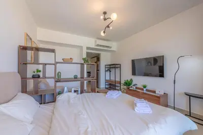 a bedroom with a large white bed in a room at The Contemporary Condo in Gouna in Hurghada