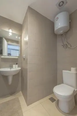 a bathroom with a toilet and a sink at The Contemporary Condo in Gouna in Hurghada