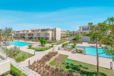 an aerial view of the pool at a resort at The Contemporary Condo in Gouna in Hurghada