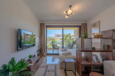 a living room with a couch and a table at The Contemporary Condo in Gouna in Hurghada
