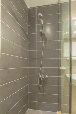 a shower with a glass door in a bathroom at The Contemporary Condo in Gouna in Hurghada