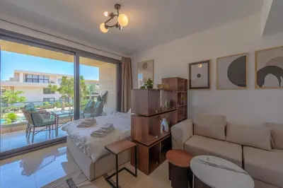 a living room with a bed and a couch at The Contemporary Condo in Gouna in Hurghada