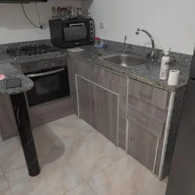 a kitchen with a sink and a microwave at الغردقة الانتر in Hurghada