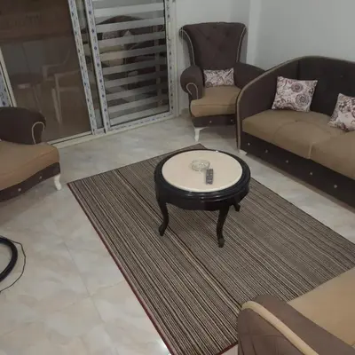 a living room with couches and a coffee table at الغردقة الانتر in Hurghada