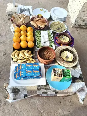 a table filled with lots of different types of food at Rayan Nubian Guest House in Aswan