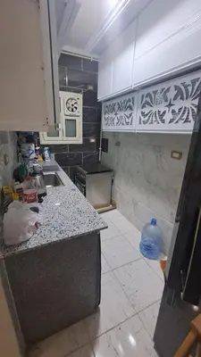 a kitchen with a sink and a counter top at الغردقه الكوثر in Hurghada