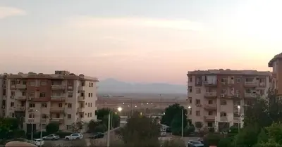 a view of two apartment buildings at sunset at Hurghada cozy apartment in Hurghada