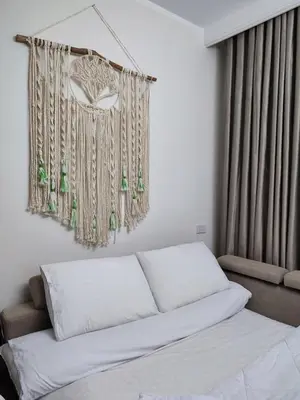 a bedroom with a bed and a window with curtains at Perfect studio for holiday in Hurghada