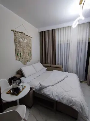 a hotel room with a bed and a table at Perfect studio for holiday in Hurghada