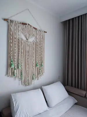 a bedroom with a bed with white sheets and a window at Perfect studio for holiday in Hurghada