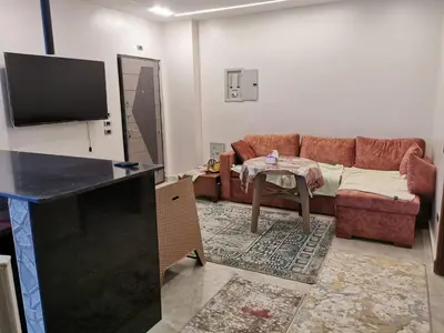 a living room with a couch and a table at Apartment in Hurghada , Ahyaa, , in front of Royal beach in Hurghada