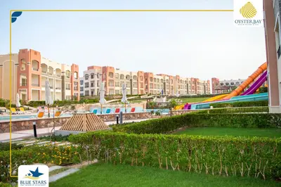 a park with a slide and a playground at Oyster bay resort studio in Marsa Alam