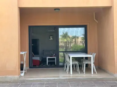 a table and chairs sitting outside of a house at The view -Clubhouse in Hurghada