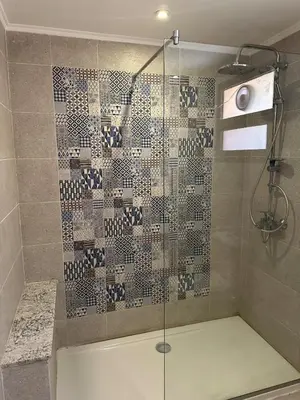 a shower with a glass door in a bathroom at The view -Clubhouse in Hurghada