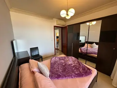 a bedroom with a couch and a mirror at The Nubian Sea View in Hurghada