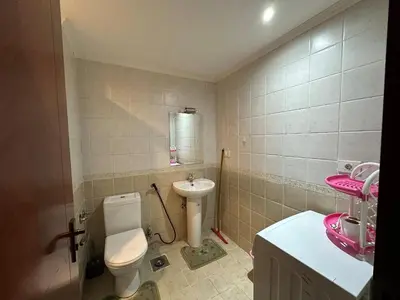 a small bathroom with a toilet and a sink at The Nubian Sea View in Hurghada