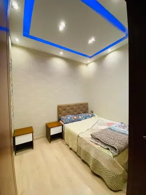 a bedroom with a bed and a blue ceiling at The Hill House in Hurghada