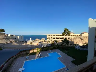 a view of a swimming pool at a resort at The Hill House in Hurghada